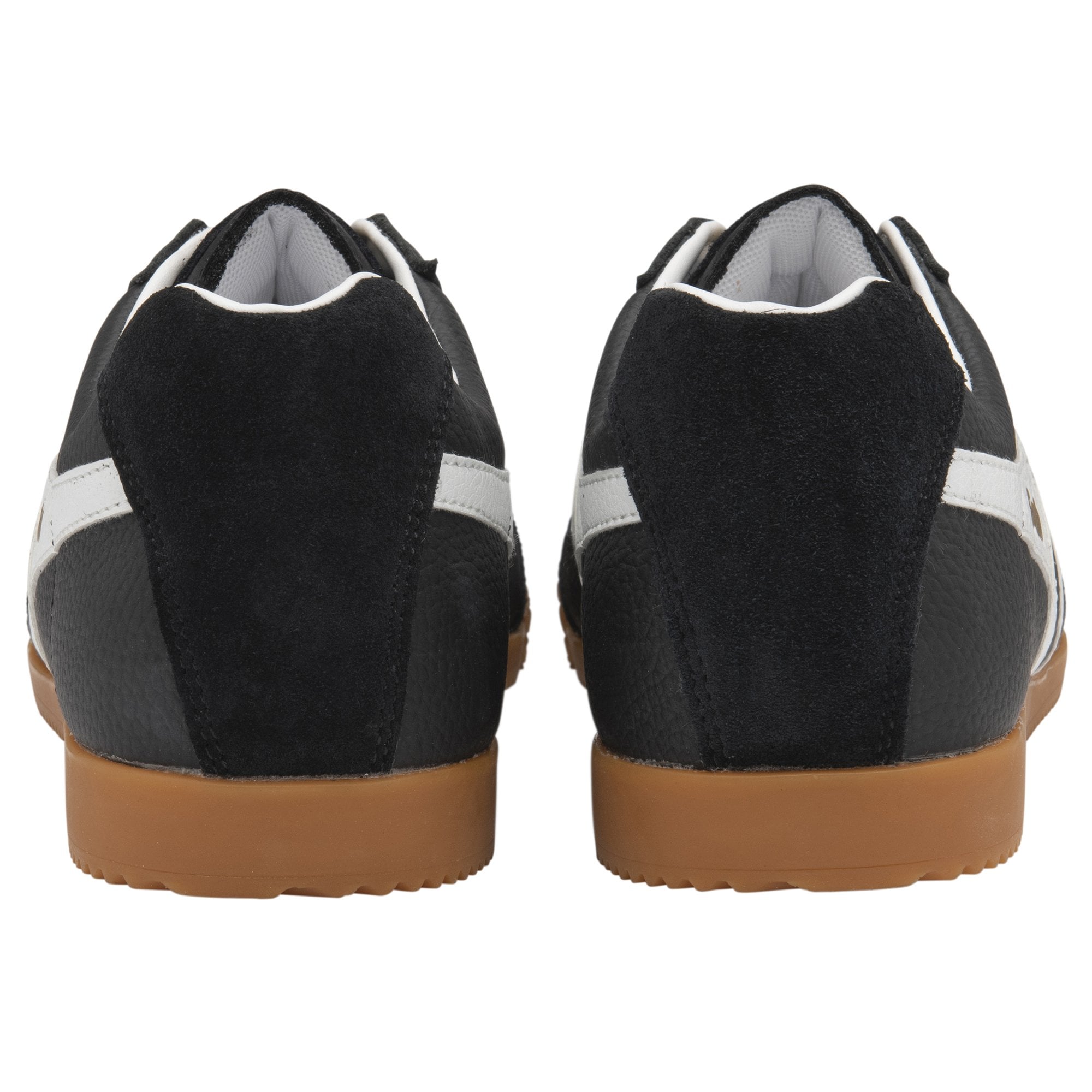 Pair of black sneakers with white stripes and brown soles, rear view