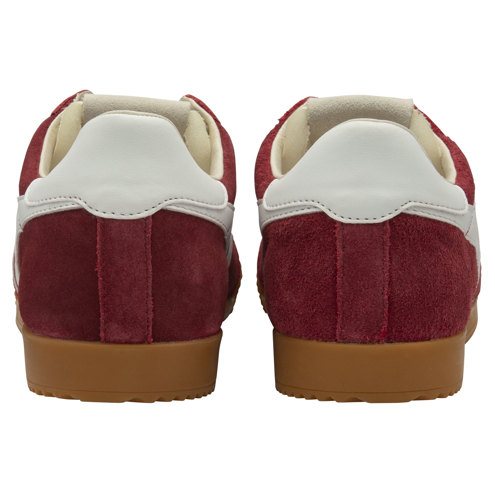 Pair of red suede sneakers with white heel tabs and gum soles, rear view