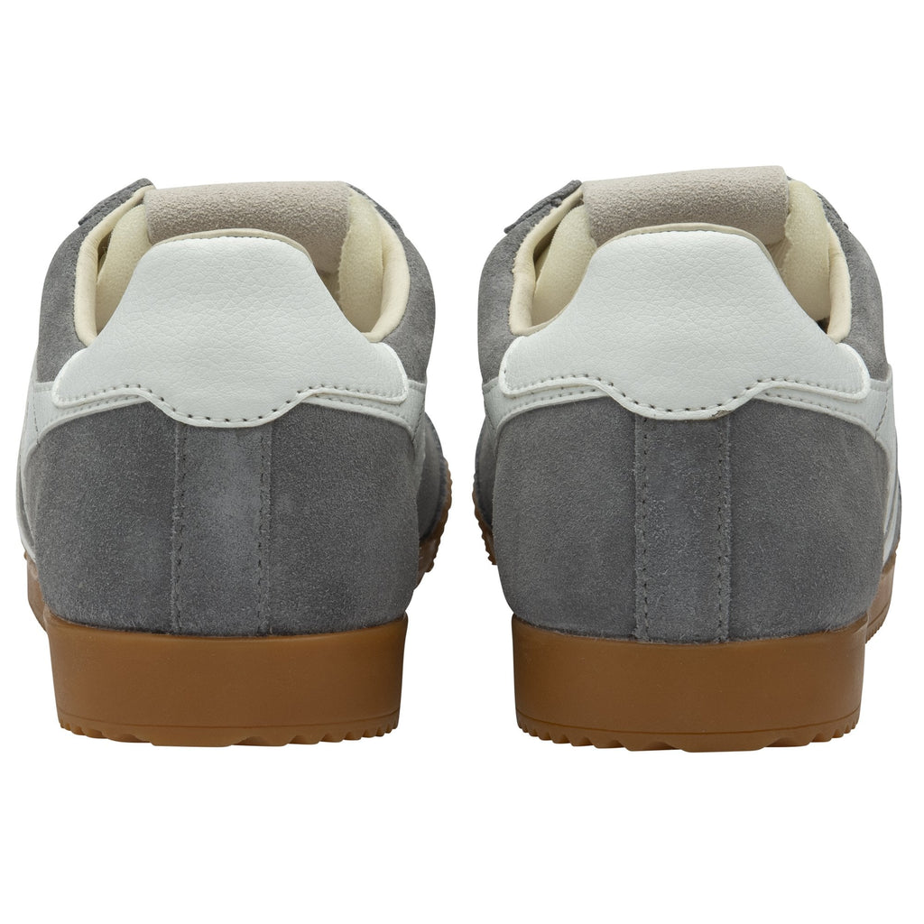 Pair of grey suede sneakers with white heel tabs and brown rubber soles, rear view