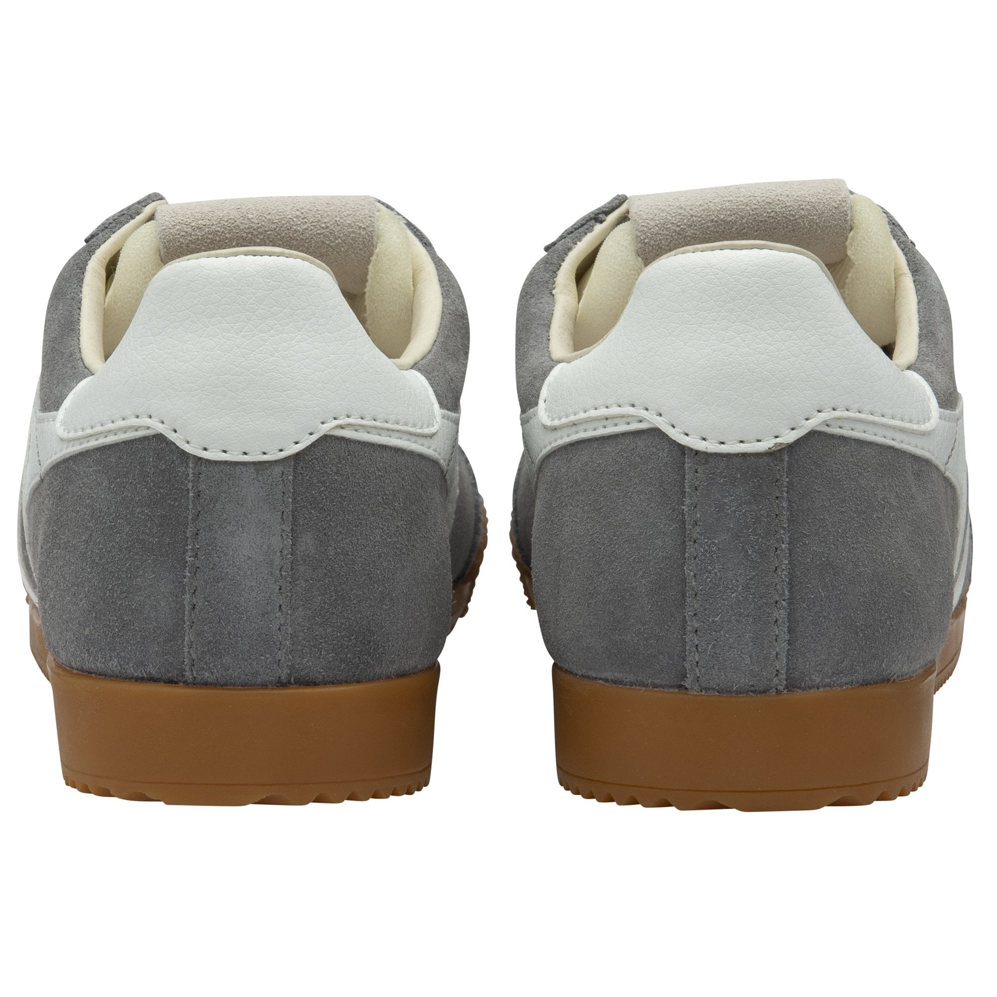 Pair of grey suede sneakers with white heel tabs and brown rubber soles, rear view