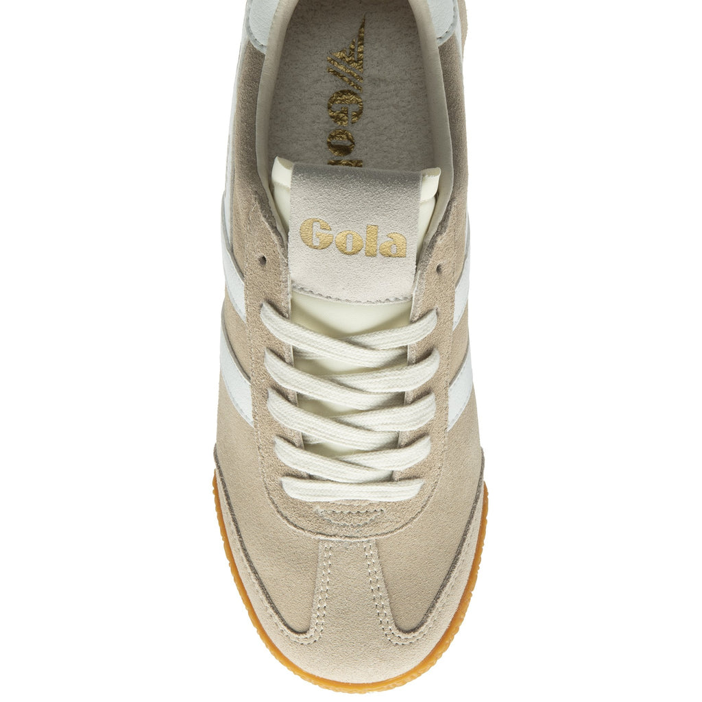 Top-down view of a single Gola Harrier trainer in off-white with white stripes.