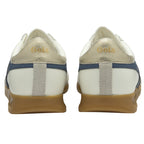 A pair of white and blue Gola sneakers with gum soles, viewed from the back.