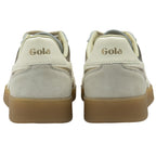 The back of a pair of Gola sneakers, showing the Gola logo on the heel.