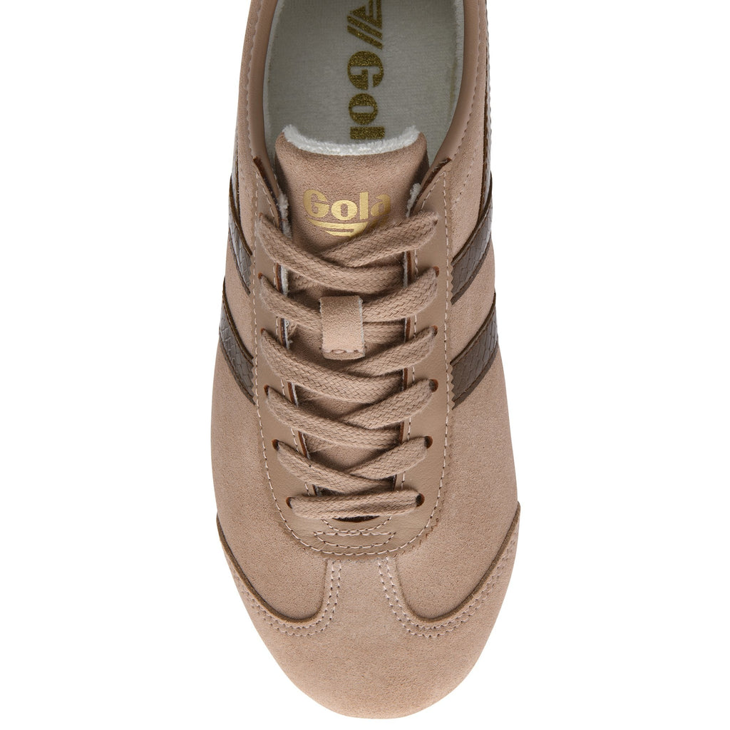 Top-down view of a tan suede sneaker with dark brown stripes and laces.