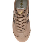 Top-down view of a tan suede sneaker with dark brown stripes and laces.