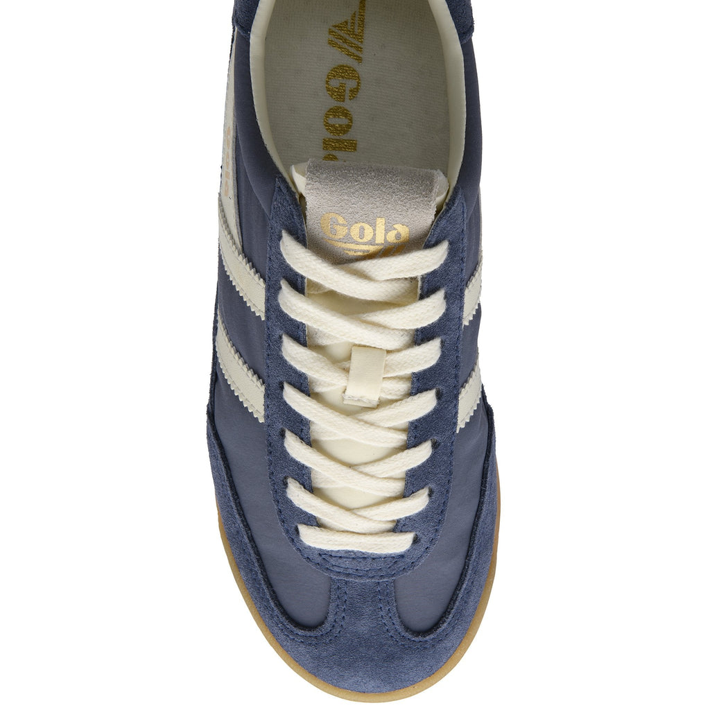Overhead view of a blue Gola sneaker with cream laces and stripes.