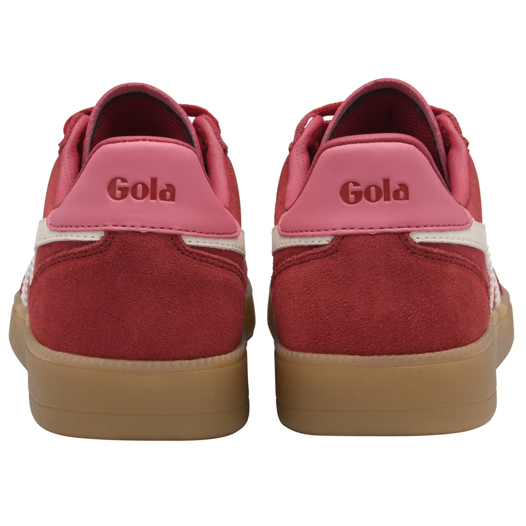 Rear view of two red suede Gola sneakers with pink heel tabs and gum soles.
