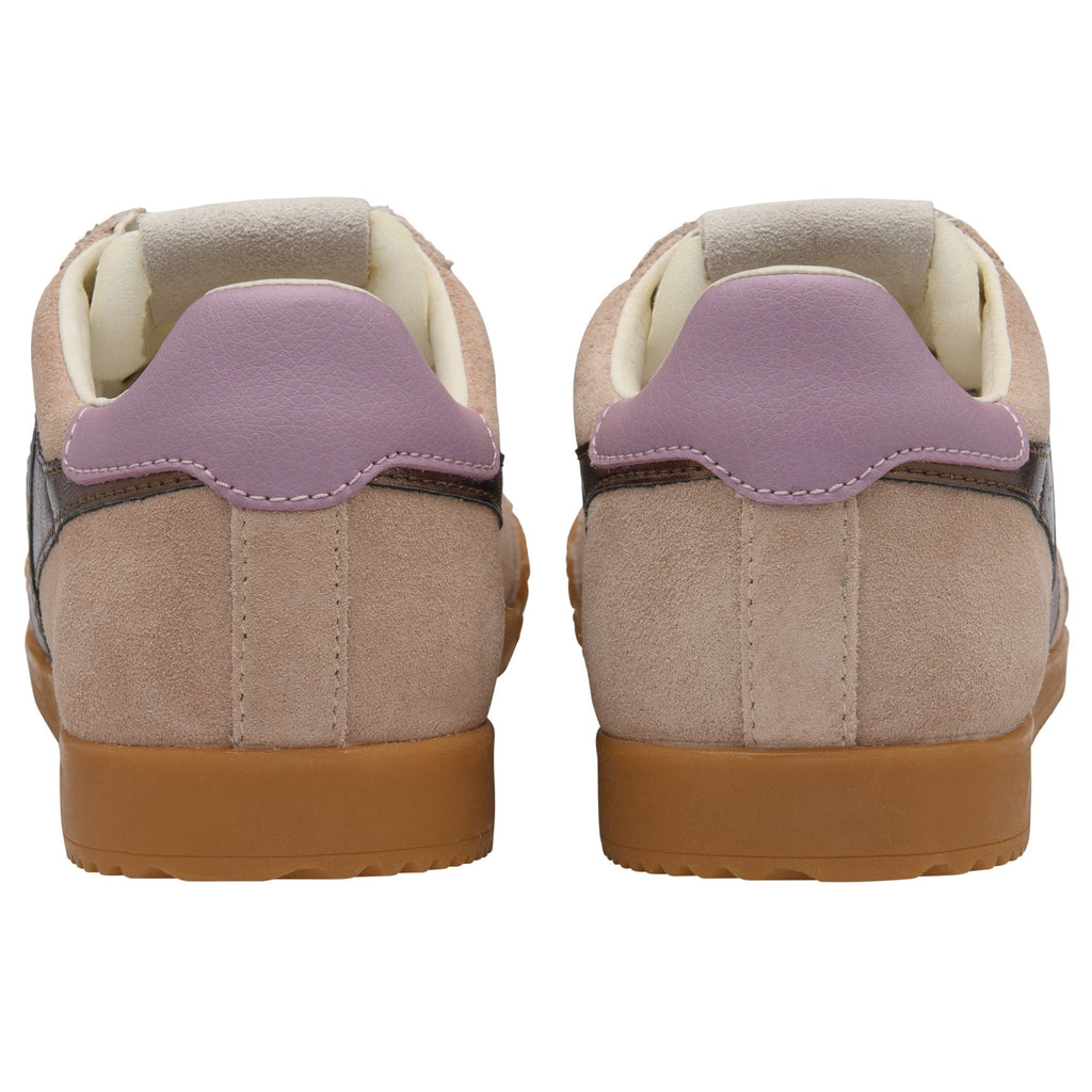 Rear view of two beige suede sneakers with purple heel tabs and brown rubber soles.