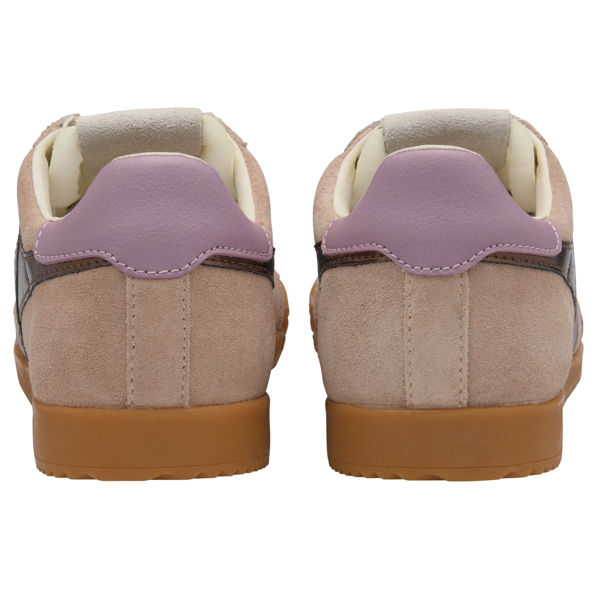 Rear view of two beige suede sneakers with purple heel tabs and brown rubber soles.