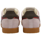 Back view of two light pink suede sneakers with brown heels and gum soles.