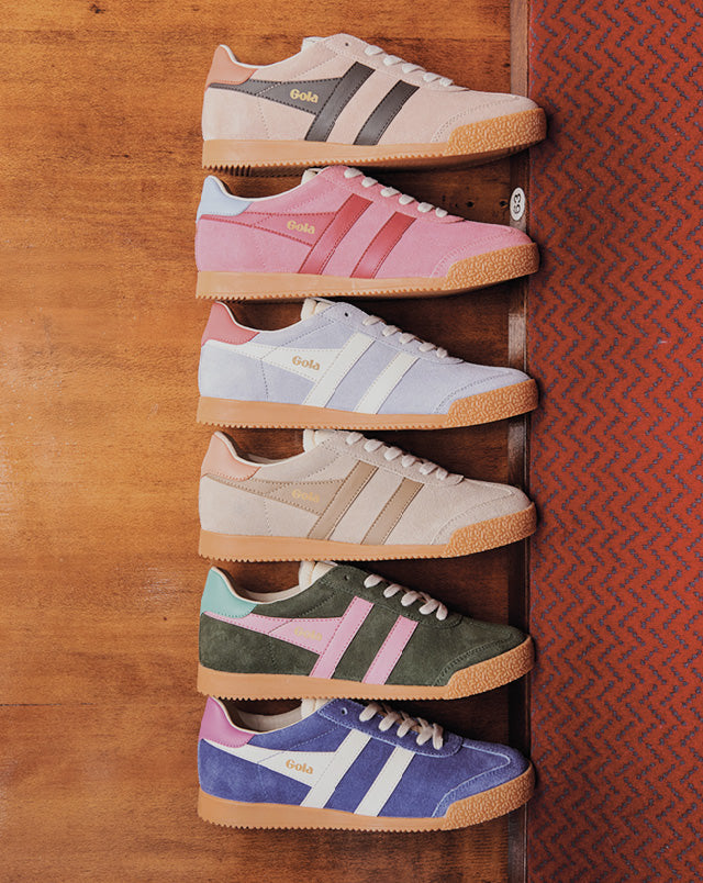 Six pairs of Gola sneakers in various colors, including pink, blue, green, and purple, arranged vertically